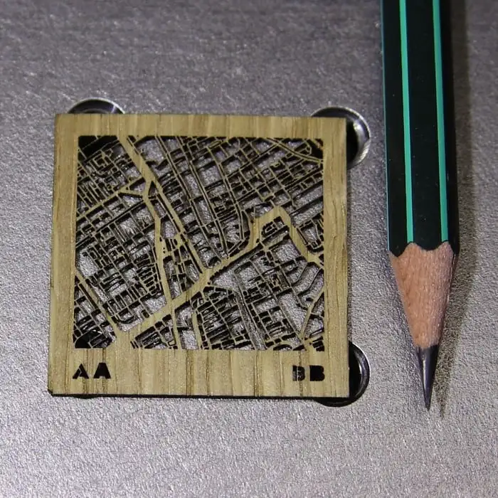 Laser Cut Plywood Showing How Precisely XT-50 Laser Head Can Cut Compared to a Pencil Tip
