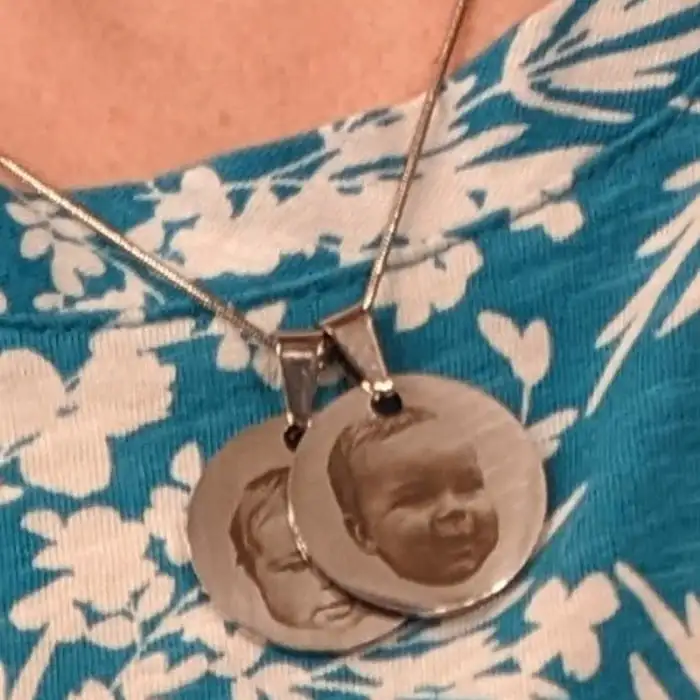 Ultra HD Precision Laser Engraved Family Photos on a Stainless Steel Necklace on Neck