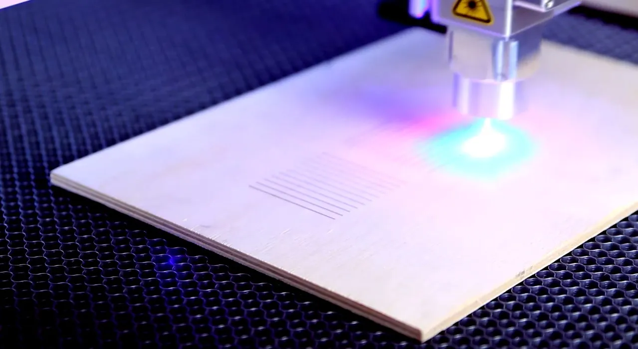 Engraving lines with a laser for working distance calibration